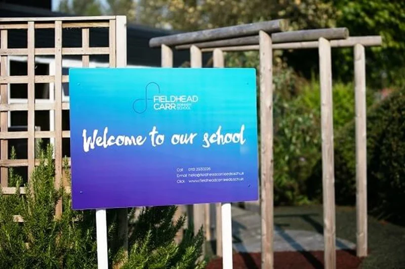 An image of a Welcome to Our School post and panel sign.